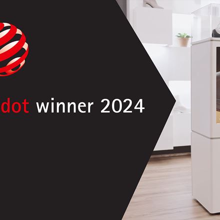IMBOX Flagship standing in store with Red Dot Award Winner 2024 logo